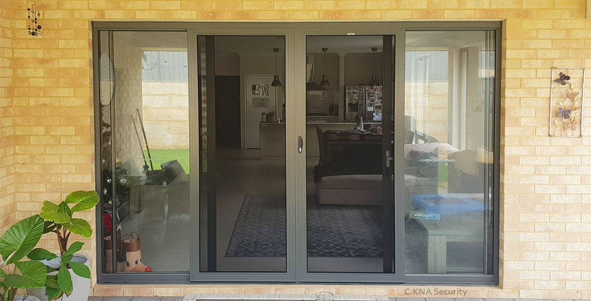 Stainless steel security door installed to Jason Glass door
